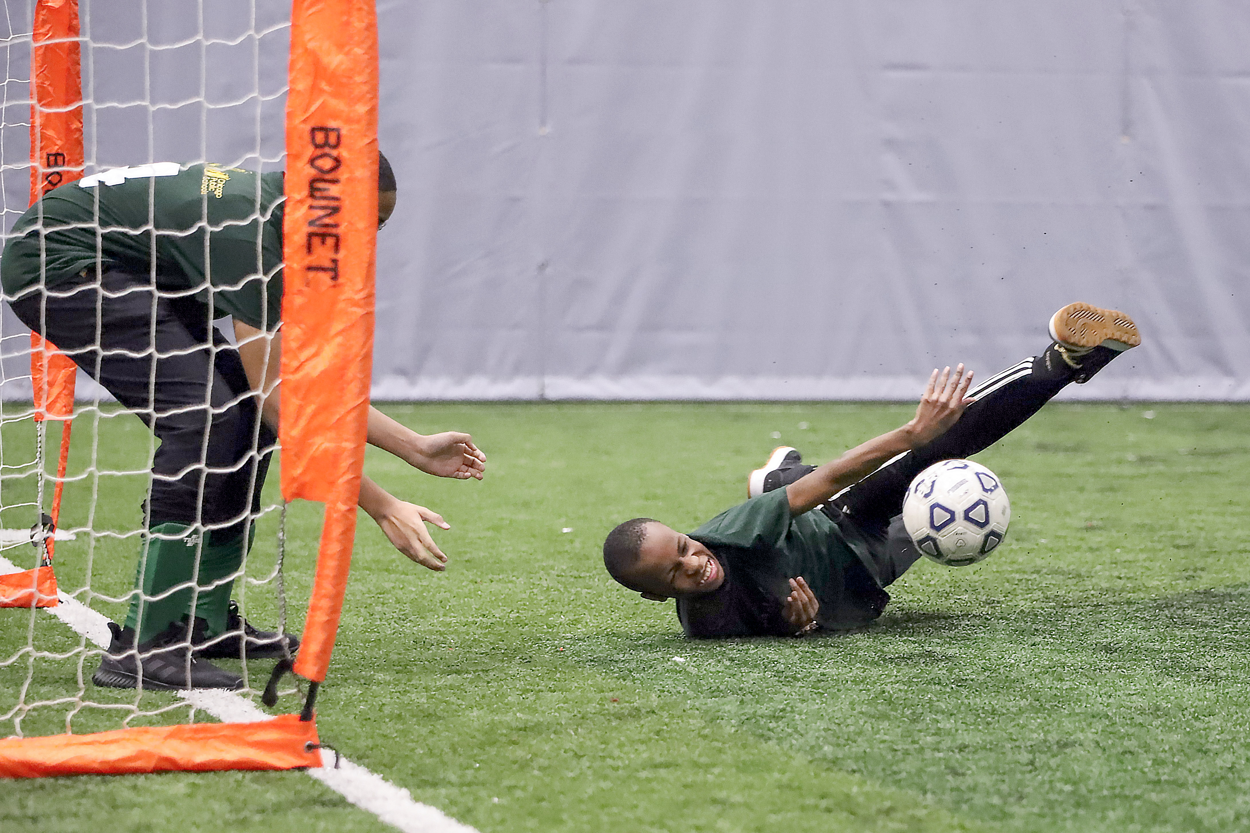 Kenneth dives towards the ball in trying to help his goalie, Kristian, save a goal at the Pullman Community Center soccer tournament held on February 8, 2023. Kenneth and Kristian are both 8th graders at Mahalia Jackson Elementary School. (Photo by Kelly Jankowski)